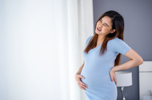 pregnant Asian woman back pain main
